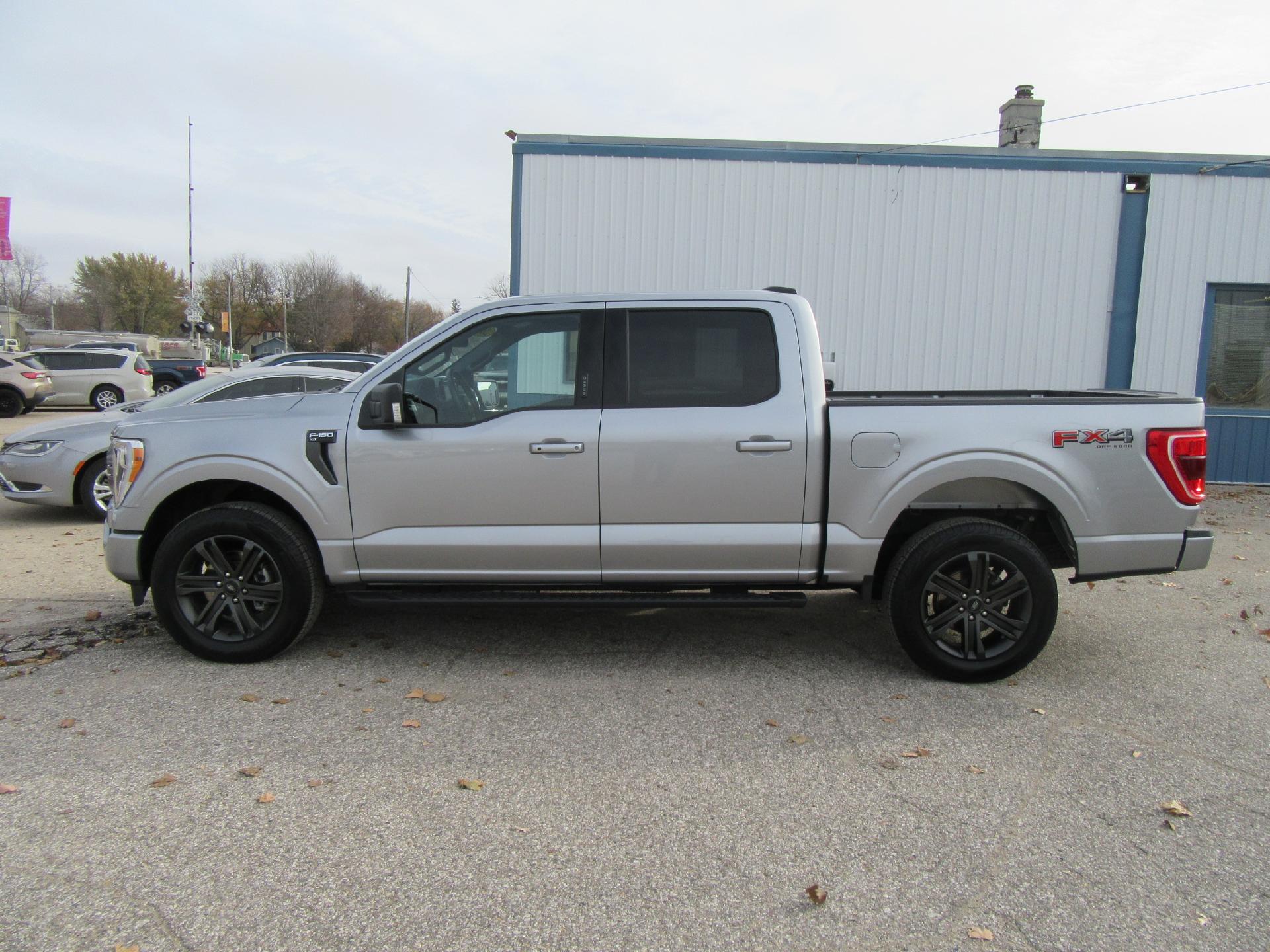 Used 2022 Ford F-150 XLT with VIN 1FTFW1E88NKD48332 for sale in Emmetsburg, IA