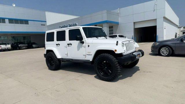 Used 2014 Jeep Wrangler Unlimited Sahara with VIN 1C4BJWEG4EL111042 for sale in Grand Island, NE