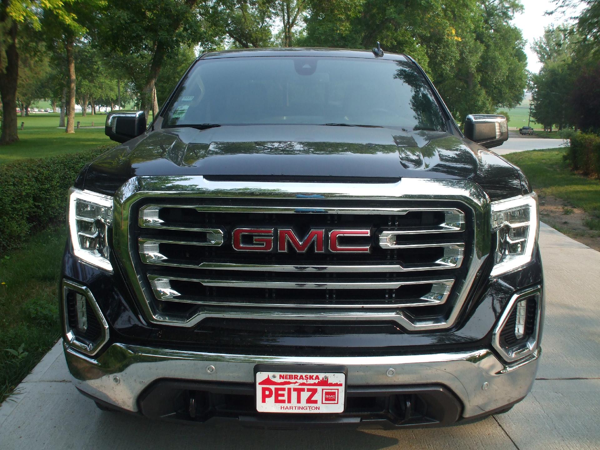 Used 2021 GMC Sierra 1500 SLT with VIN 1GTU9DETXMZ161605 for sale in Hartington, NE