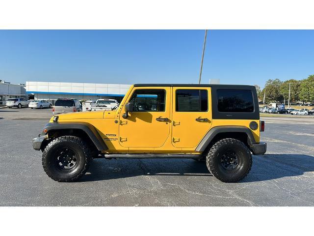 Used 2015 Jeep Wrangler Unlimited Sport with VIN 1C4BJWDG5FL650238 for sale in Florence, AL