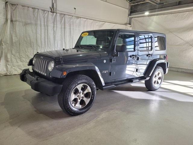 Used 2016 Jeep Wrangler Unlimited Sahara with VIN 1C4BJWEG5GL327002 for sale in Pinconning, MI