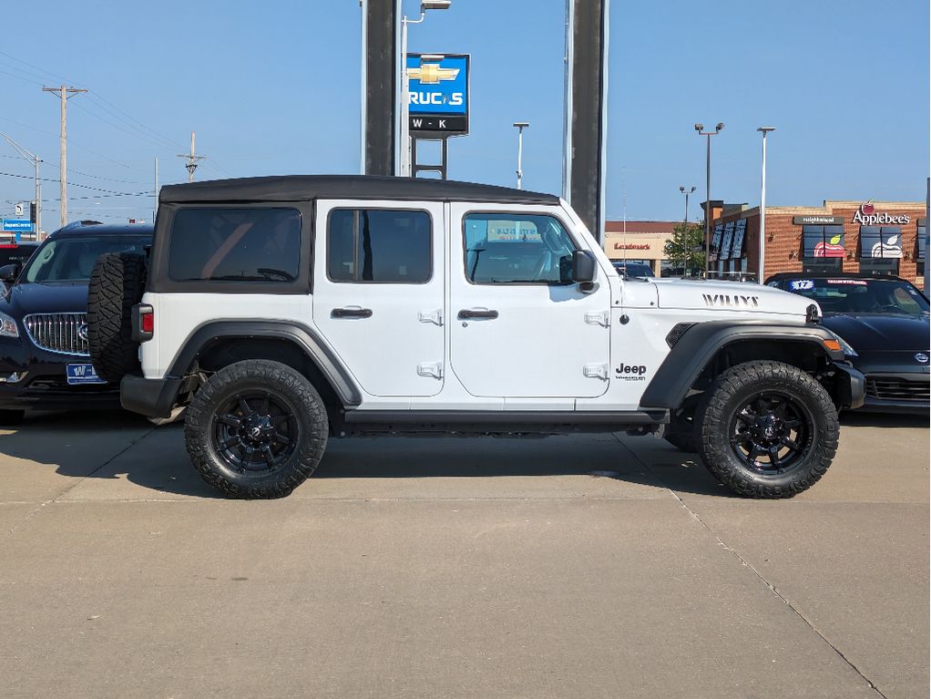 Used 2022 Jeep Wrangler Unlimited Willys Sport with VIN 1C4HJXDG2NW276233 for sale in Kansas City