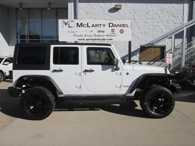 Used 2014 Jeep Wrangler Unlimited Sport with VIN 1C4BJWDG9EL250732 for sale in Bentonville, AR