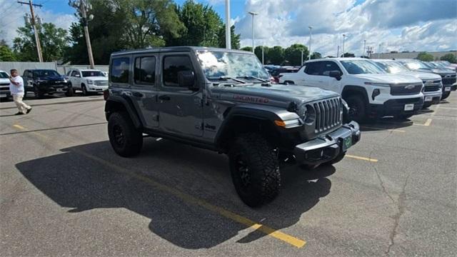 Used 2023 Jeep Wrangler 4-Door High Tide with VIN 1C4HJXDGXPW648551 for sale in Saint Cloud, MN